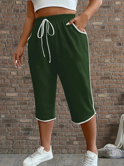 Plus size women's contrasting comfortable stretch cropped pants with solid color functional pockets, medium stretch, suitable fo