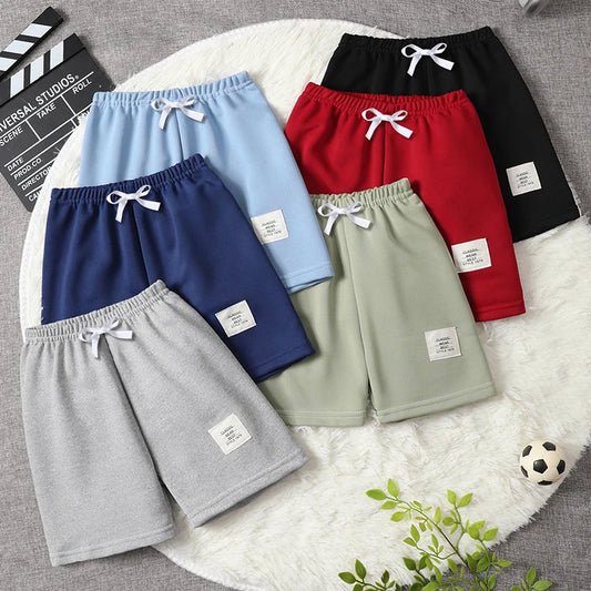 Enfärgade barnshorts med dragsko och elastisk midja